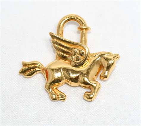 hermes cadena gold pegasus horse motif bag charm lock 071|Hermes Cadena Gold Pegasus horse motif bag charm lock.